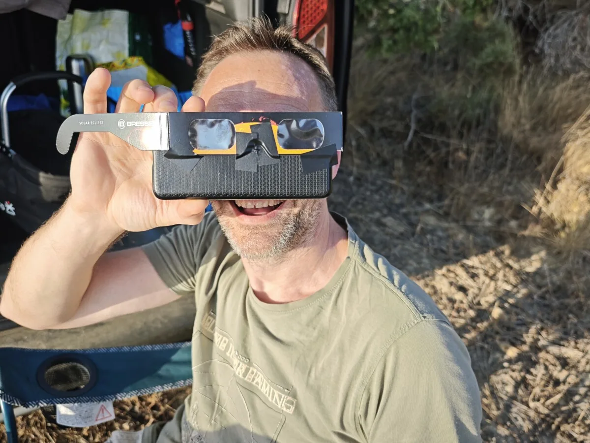 An eclipse glass taped to a phone